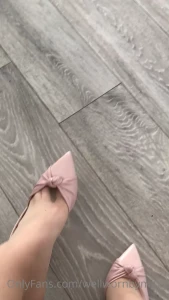 Putting on my sling backs and stretching the strap the shoes are