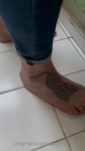 Feet paparazzi while doing the dishes