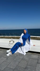 I walk barefoot along the seashore the wind plays with my hair salty