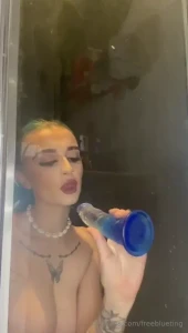 Watch me suck and ride my dildo in the shower