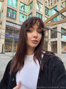 The city is noisy passers-by are hurrying and i walk slowly - maybe