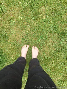 Bare feet in the soft grass
