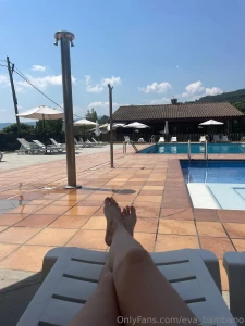 Lying by the pool the sun sliding on my skin and the water beckoning