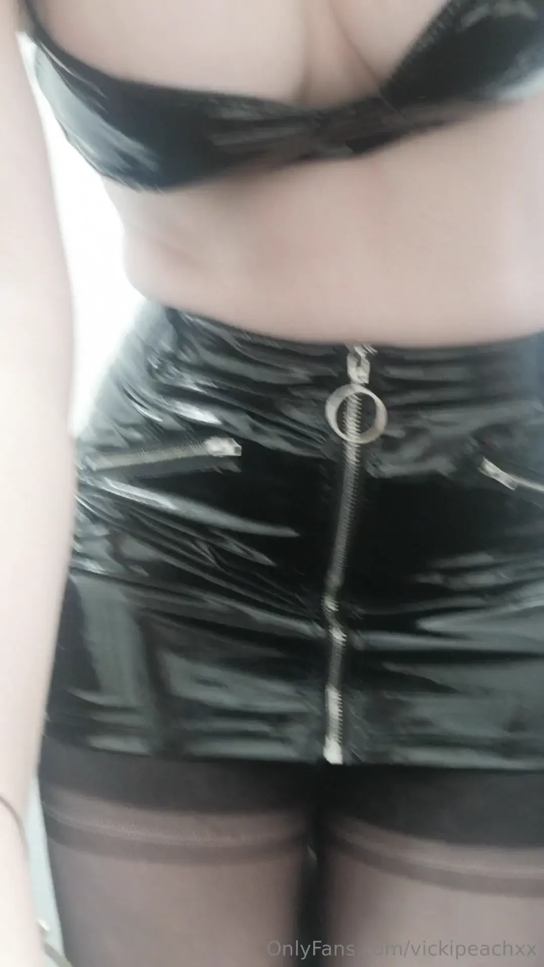 Dressed in pvc and fully fashion stockings 