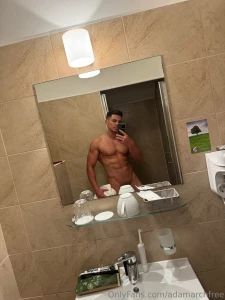 The bathroom mirror reflects more than just my body