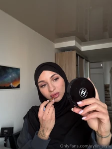 I glide the lipstick across my lips slowly deliberately the mirror