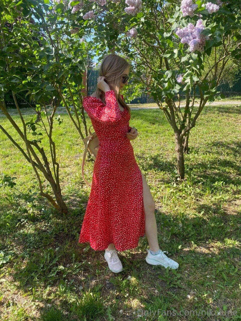 Soft sunlight blooming lilacs and just a little me in red 