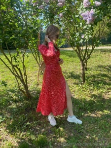 Soft sunlight blooming lilacs and just a little me in red