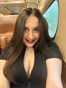 The train sways gently city lights flashing past the window and right