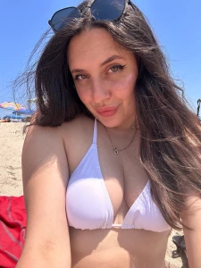 A white bikini warm sand and me playing with the waves would you come