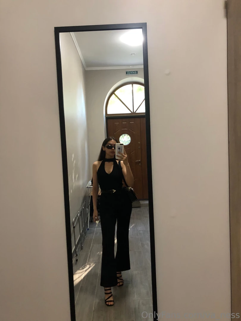 Fully dressed in black exuding mystery and confidence ready to turn 