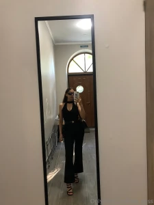 Fully dressed in black exuding mystery and confidence ready to turn