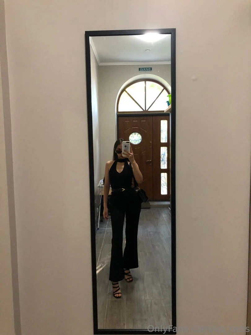 Fully dressed in black exuding mystery and confidence ready to turn part 1 