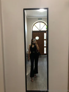 Fully dressed in black exuding mystery and confidence ready to turn part 1