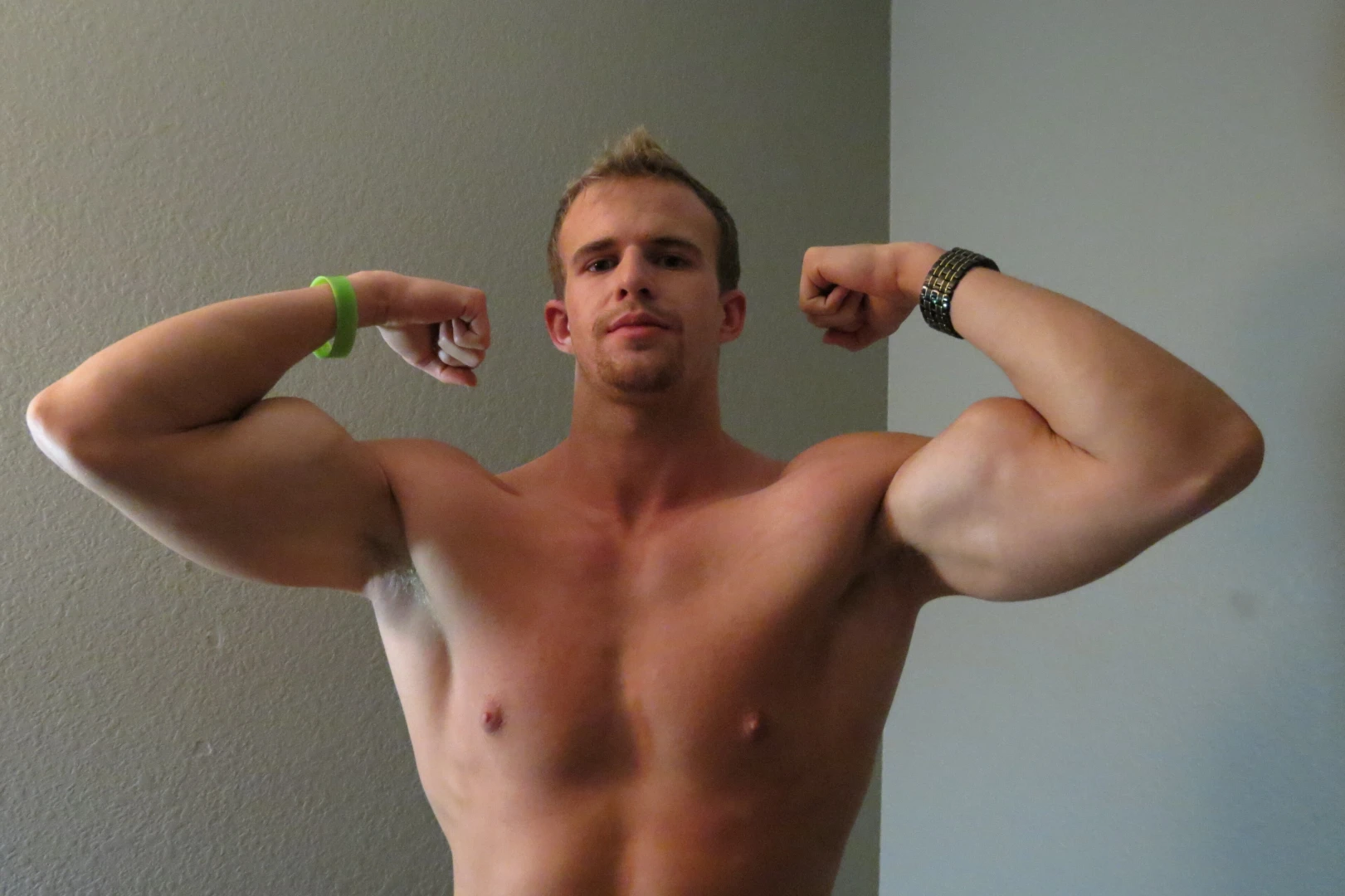 Flexing feeling pumped after a workout 