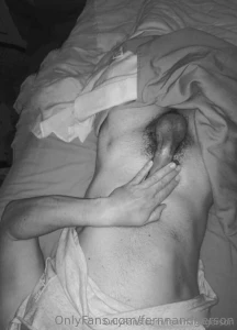 Naked in bed touching my cock