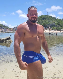 Everyone looks at a muscular man with full trunks