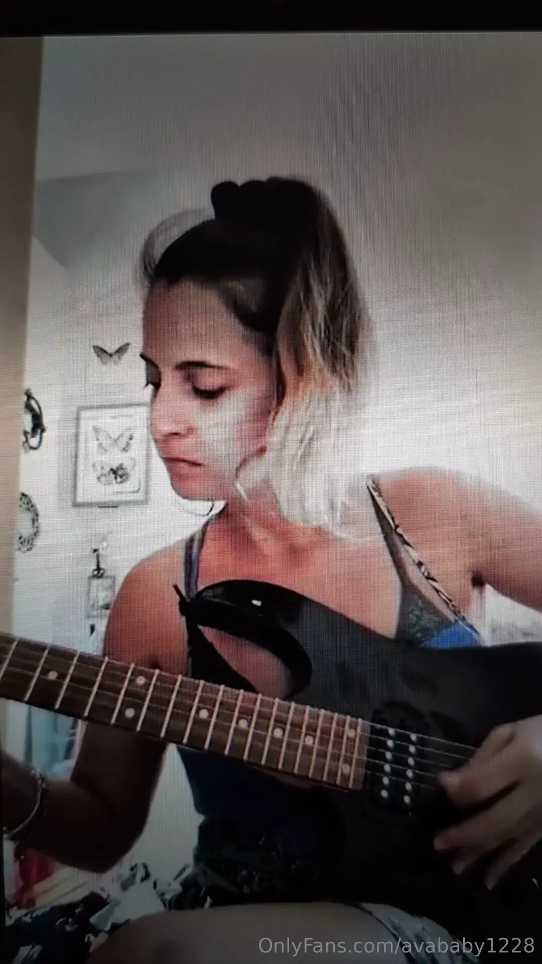 A sexy nurse that plays the guitar 