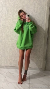 Green hoodie day barefoot and happy