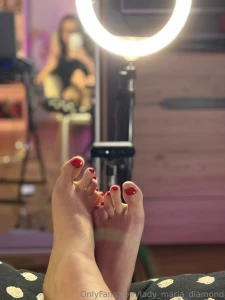Bold red nails ring light glow and a streaming vibe - teasing the