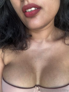 Can you resist her red lips and cleavage