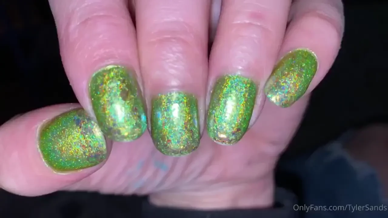 Glossy top coat on color shifting flakes on a linear holographic green 