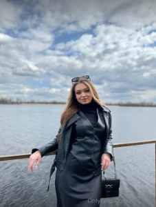 Dressed in sleek black attire i exude an aura of elegance my outfit a