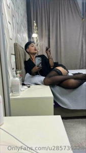 The black elegant sleeves and kopron stockings add spice to the woman