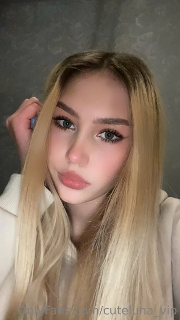 Innocence collide with allure as her rosy cheeks and enchanting gaze 