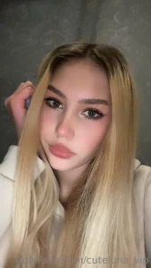 Innocence collide with allure as her rosy cheeks and enchanting gaze