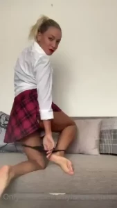Would you like to see this sexy blonde stripteasing in this school