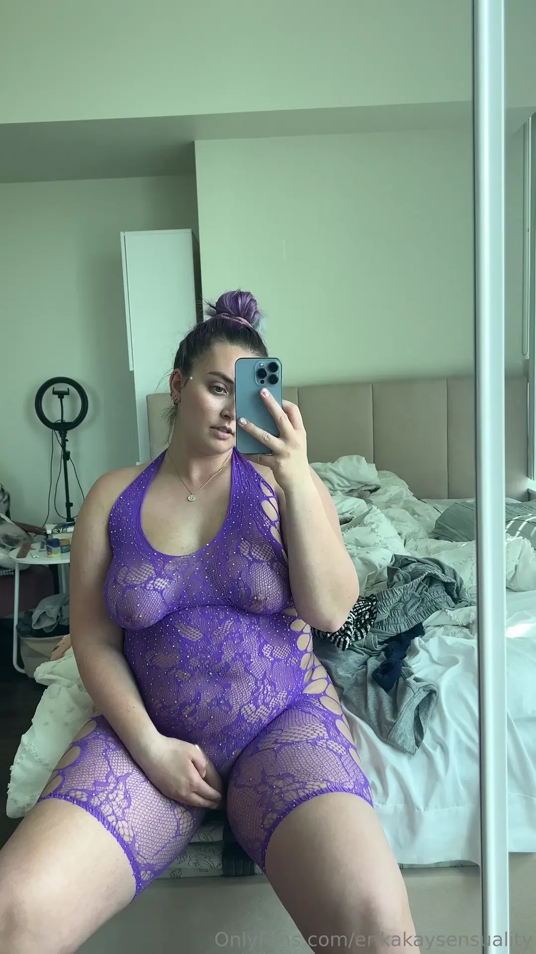 Using a vibrator through this fishnet bodysuit you can see my pussy 