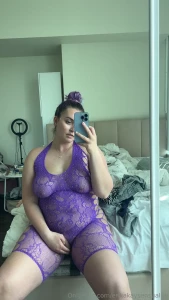 Using a vibrator through this fishnet bodysuit you can see my pussy