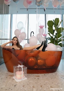 I m smiling in a sexy lingerie there s a lot of balloons around and a part 1