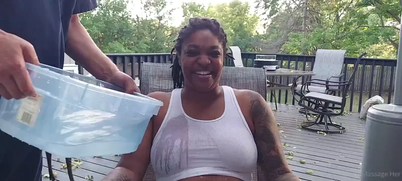 O moonstruckdahlia outside with water and tank top playing 