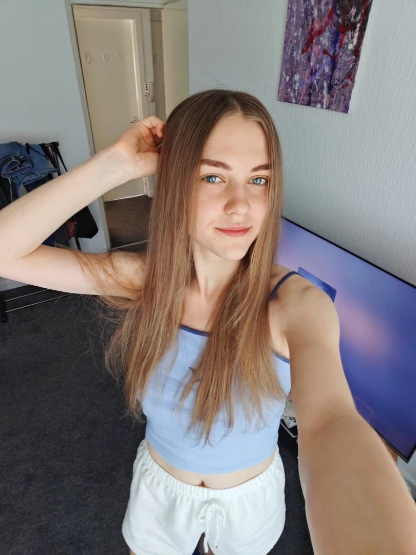 The morning light softly shines through the curtains filling the room 