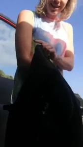 A tiny bit of public flashing while changing by the side of the road