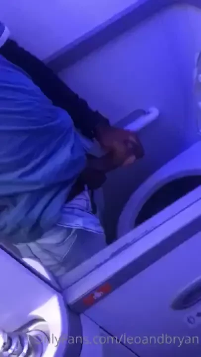 Leo cumming in the plane bathroom 