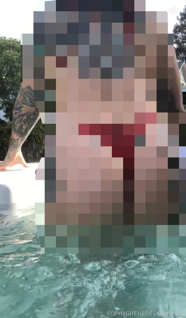 Burgundy bikinied babe exiting hot tub as the water slips off her ass 