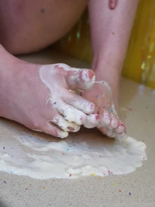 Whipped cream sprinkles and a destroyed cupcake