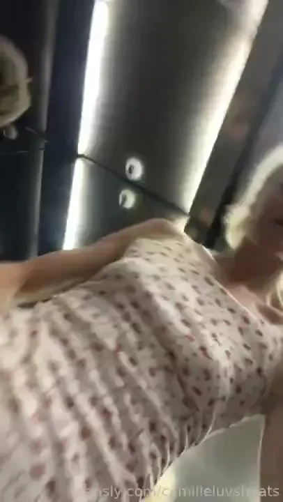 No panties under my dress so here s a pussy flash from in the elevator 