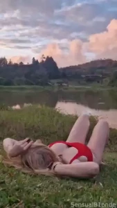 Soaking up the evening sun and showing off my favorite red swimsuit -