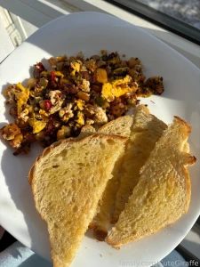 Breakfast hash with a side of bread from the bakery