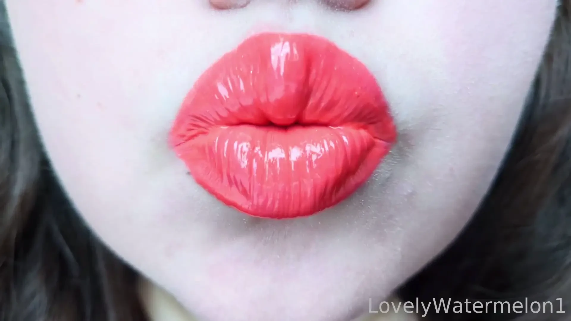 The orange gloss clings to every soft dip and swell of my lips like 