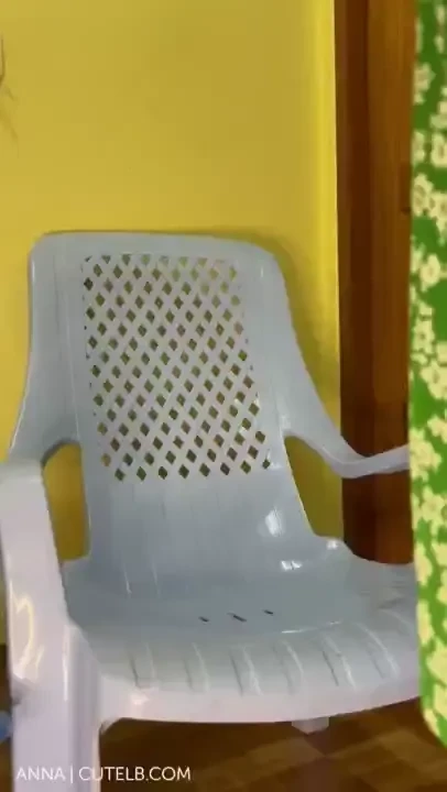 Ladyboy anna cums outside in her green dress sitting in the patio 