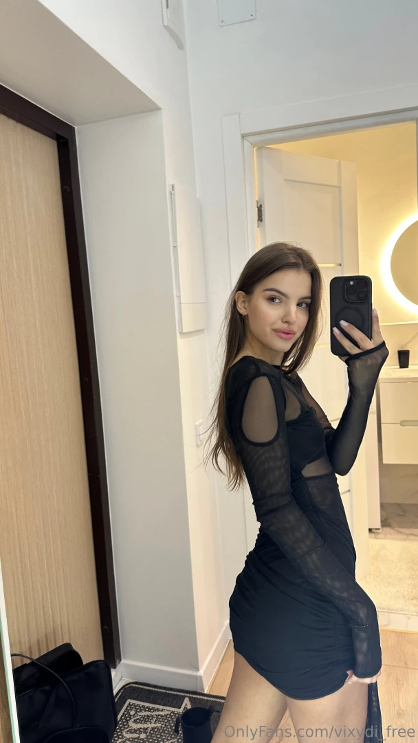 Stepping into sophistication with grace draped in a flowing black 