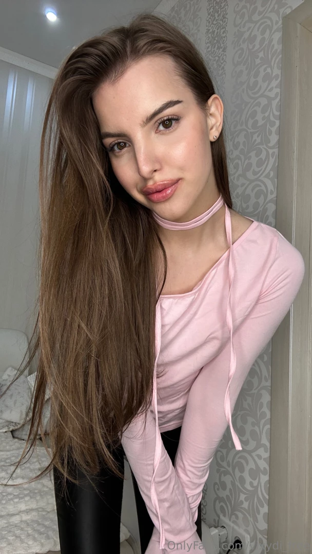 Wrapped in the gentle embrace of a blush pink blouse today it s like 