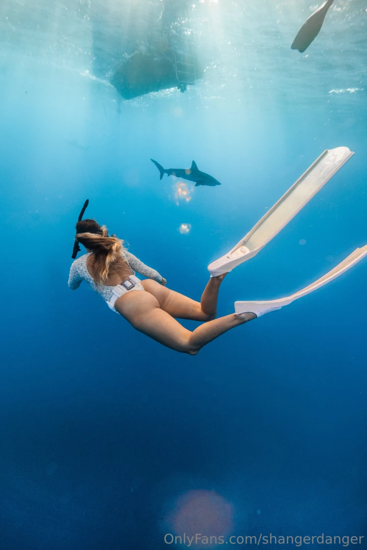 Britt out in 400 ft of water swimming with sharks i heard shark week 