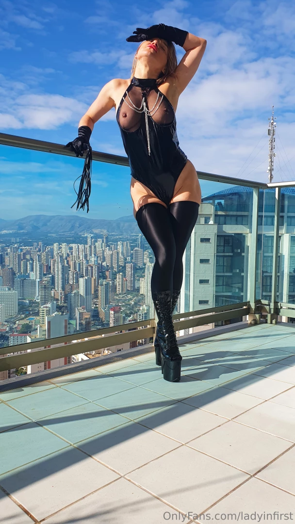 The city is beneath me and you are beneath my heel in this latex 