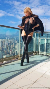 On my feet are black stockings and heels elevating me above the world